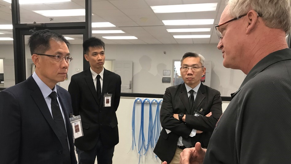 Singapore Civil Defense Forces representatives tour the COBRA Training Facility.